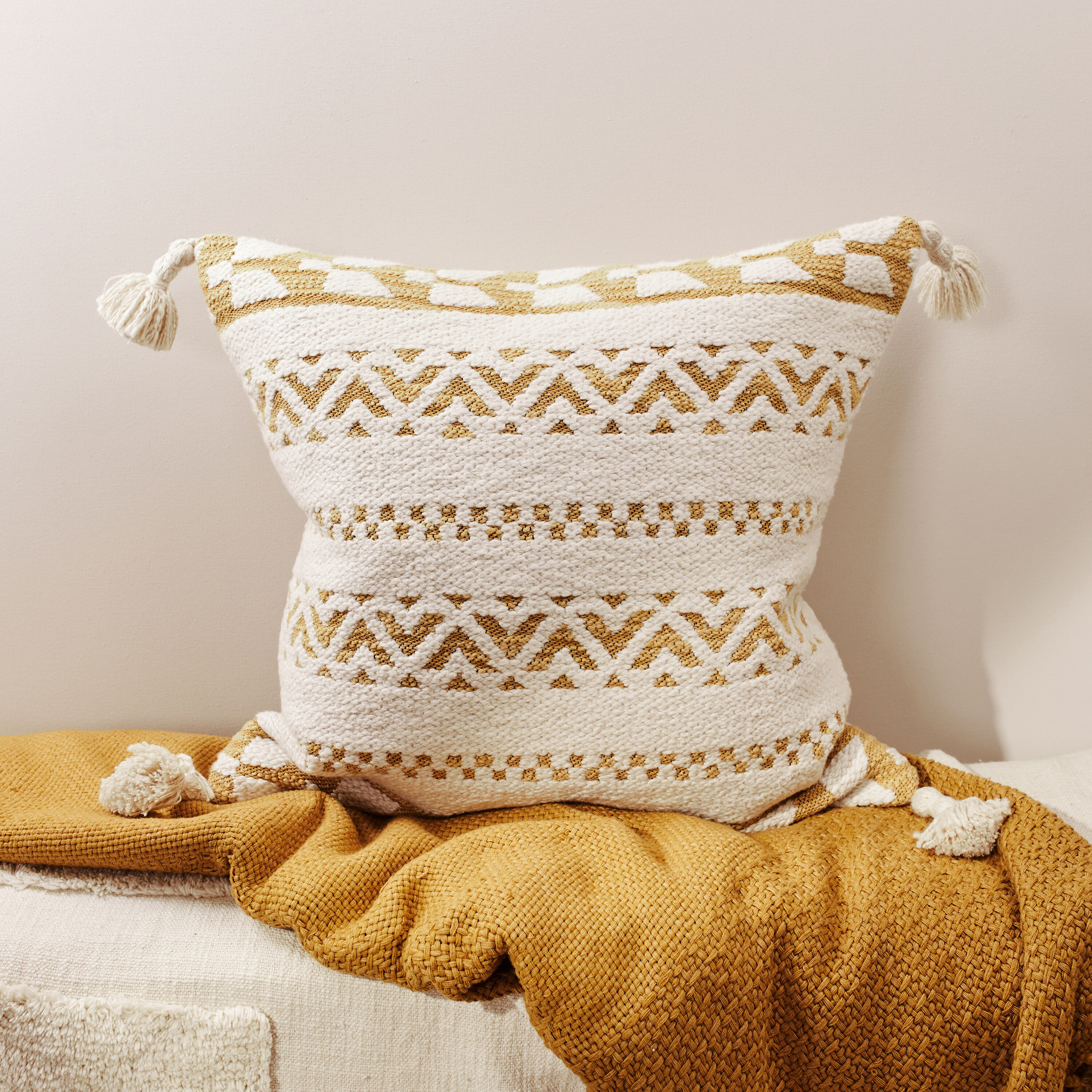 Yellow Cream Textured Cushion with Tassels Inside Story