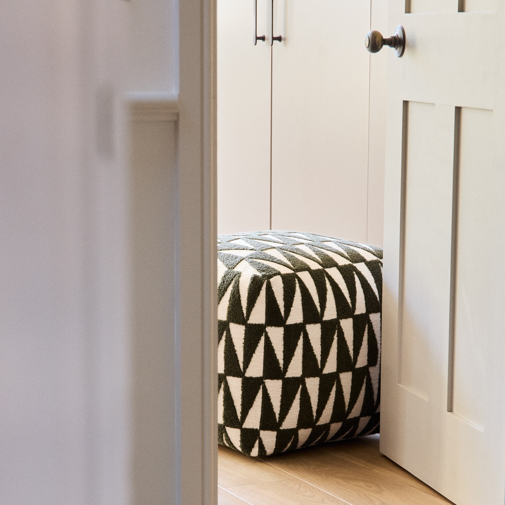 A green geometric footstool
