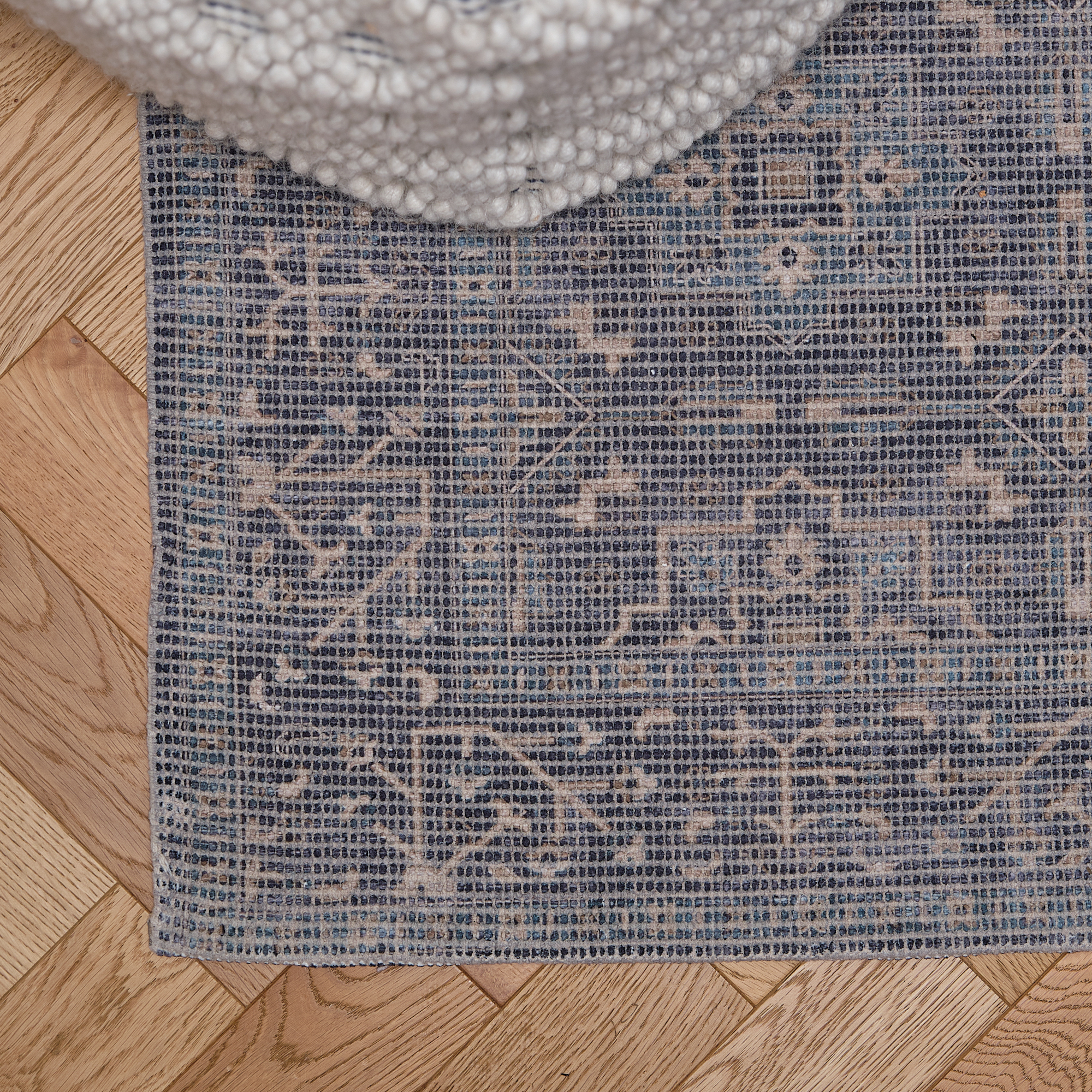 Top down view of a blue patterend rug