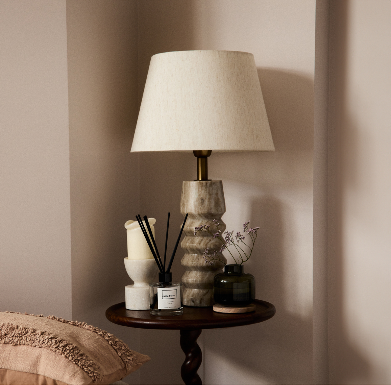 A woman wearing a green floral dress.