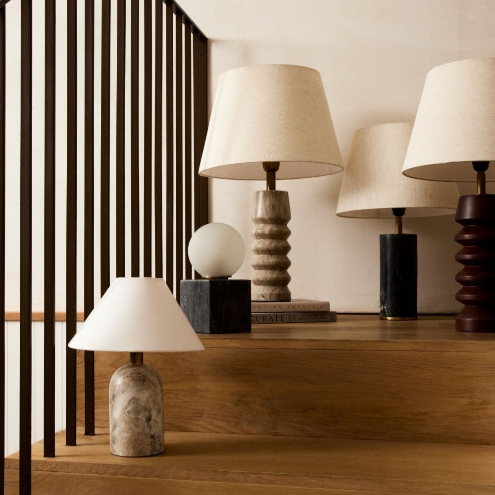 A variety of table lamps on stairs