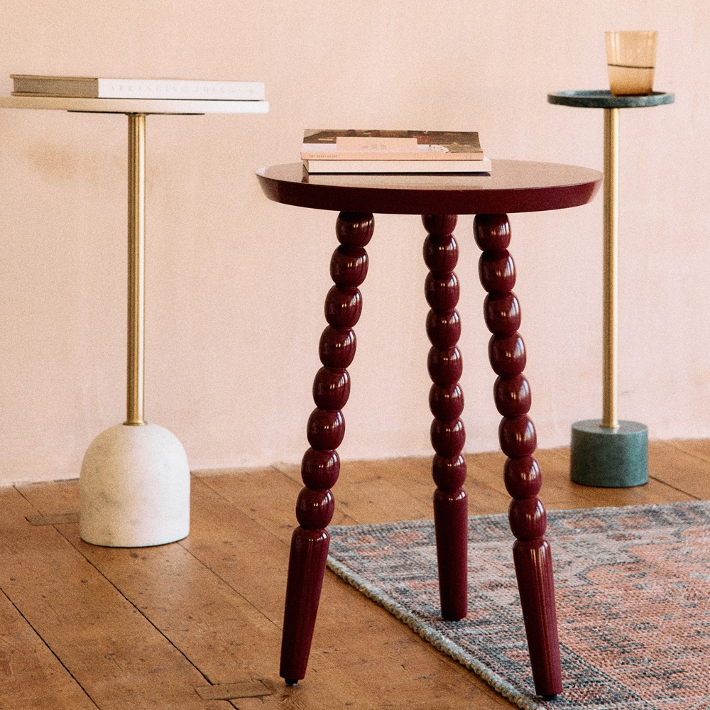 A selection of wood and marble side tables