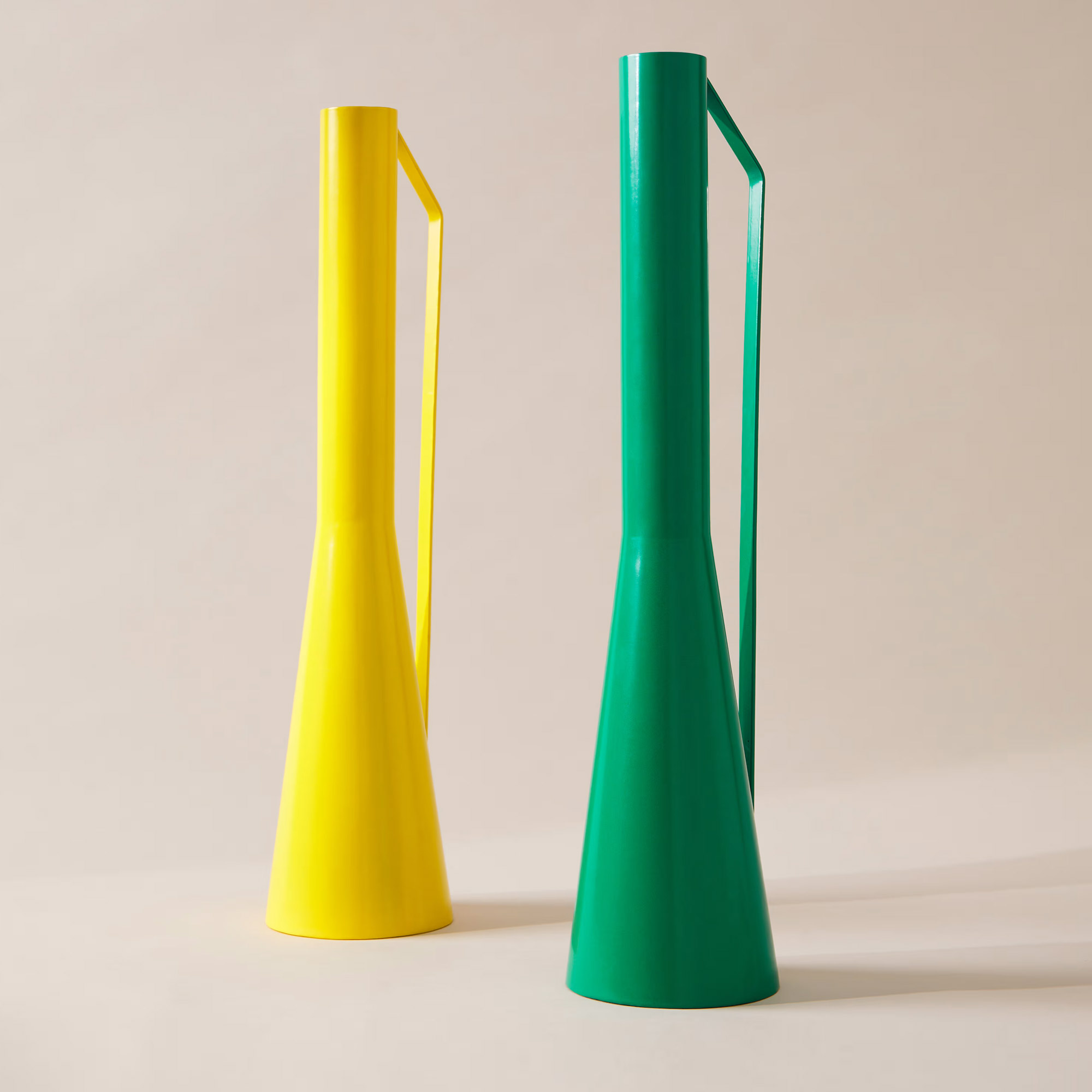 Two tall metallic jugs