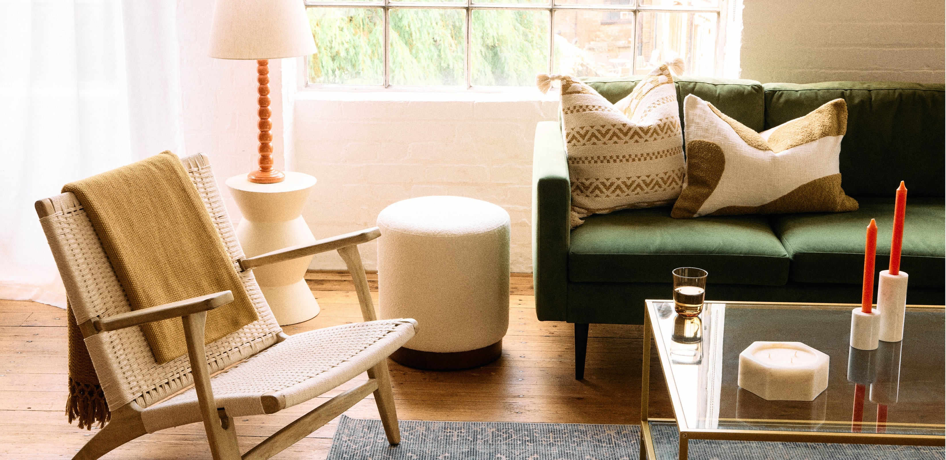 Armchair, sofa, lamp and rug in a living room